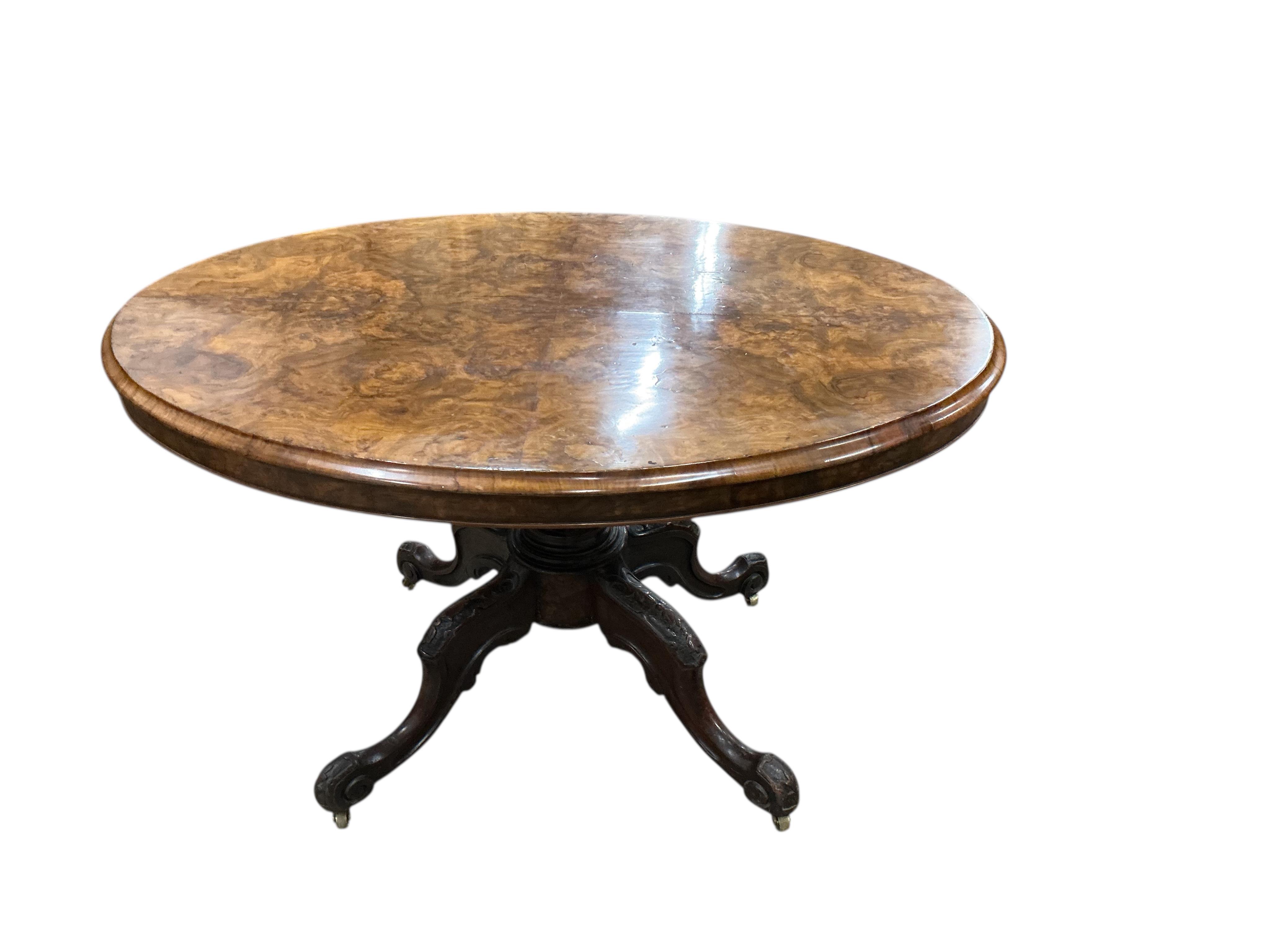 A Victorian figured walnut oval tilt top loo table, width 84cm, depth 122cm, height 72cm
